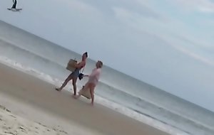 ladies at a literal beach enjoying what they see