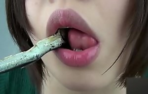 Woman eating fish around erotic
