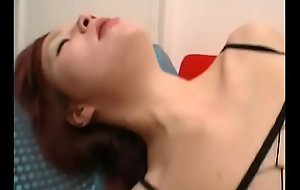 Young redhead girl banged hard by two horny dicks