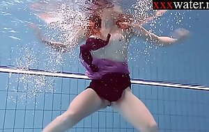 Smoking hot Russian redhead all round get under one's pool