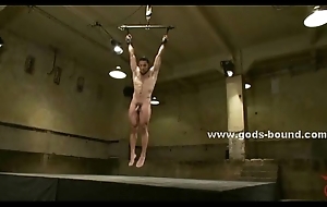 Cute greek gay hunk suspended in air