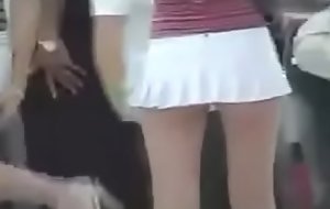 Bleached blonde asian outside whip back a white micro-mini skirt