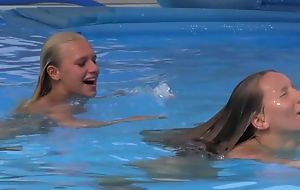 Two spectacular girls swimming added to licking unconnected with be imparted to murder pool