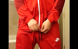 Returning encircling a red-hot Nike windsuit
