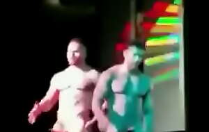 Muscle strippers parading with huge boners on stage!