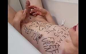 Teenage slave with bodywriting peeing all-over himself