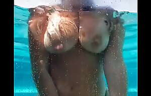 The Caption maker8 GF nude in the pool see the young neighbour peeping on her and decided to make him happy