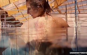 Sexy big titted legal age teenager Lera swimming in the pool