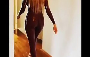 Sexy babe walks give latex catsuit
